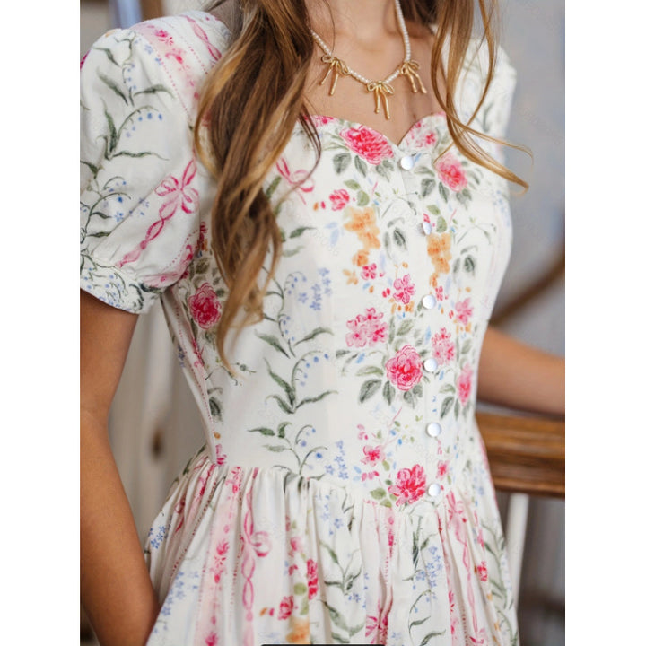 Dame Maxikjole med blomsterdesign og lange puffermar