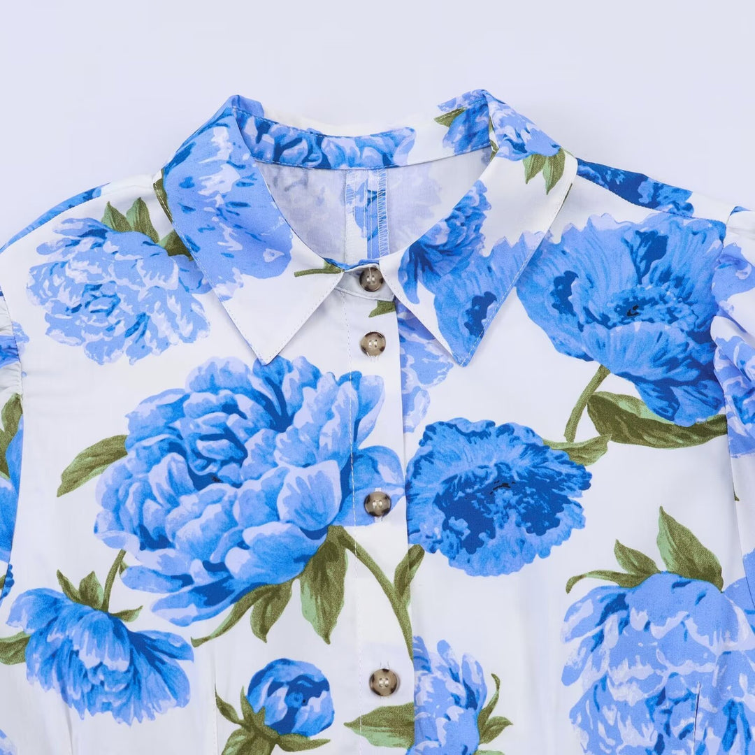 Damebluse med blomsterdesign og elegante puffermedeer Skjora
