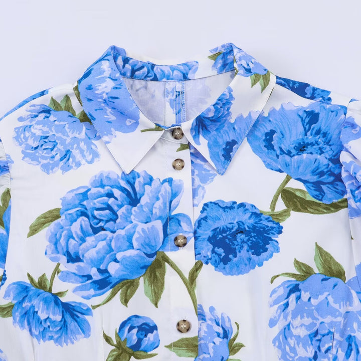 Damebluse med blomsterdesign og elegante puffermedeer Skjora