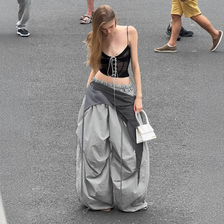 Dame modische High-Waist-bukse med asymmetrisk design og sidelivsnedbinding Skjora