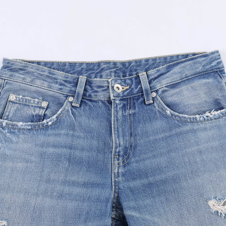 Dame Flared Jeans med ødelagte effekter og frynseavslutninger Skjora