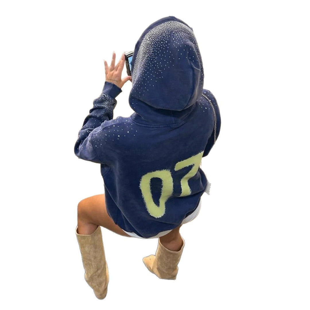 Dame sweatshirt med glitrende detaljer og iøynefallende logo Skjora