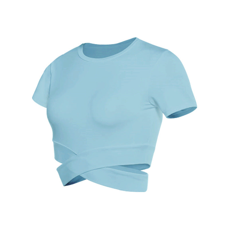Dame kortermet trenings-crop-top med innovativt draperingsutseende Skjora