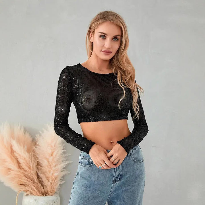 Kvinnes glitrende crop topp med lange ermer og tettsittende snitt