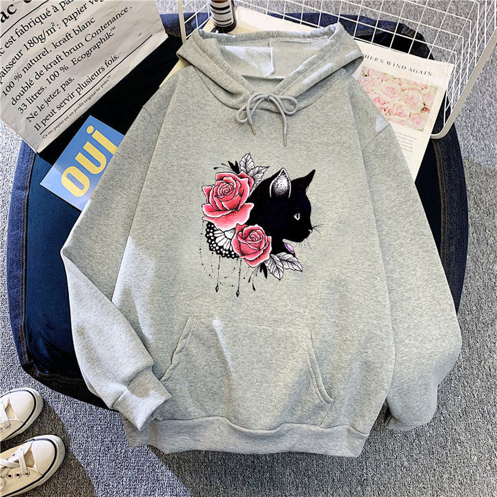 Dame hettegenser med blomstermotiv av katt Skjora