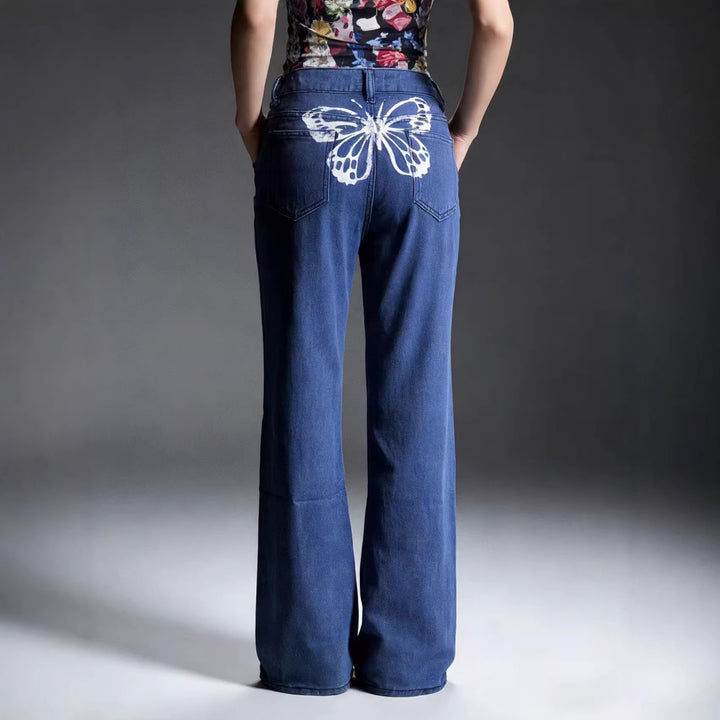 Dameviddejeans med kunstnerisk sommerfugl-design Skjora