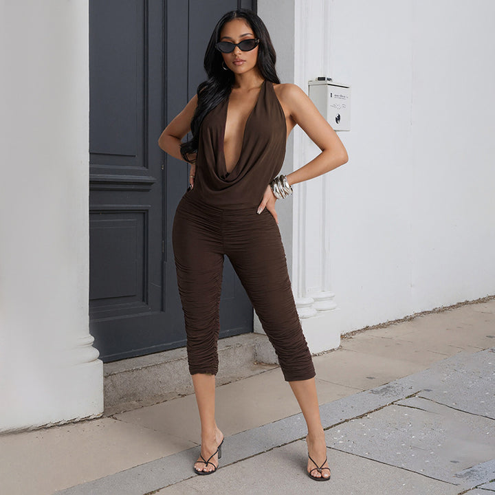 Damer elegant og figursydd jumpsuit med dyp V-hals og draperinger Skjora