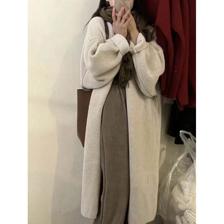 Damer lang strikket kåpe med oversized passform og myk fleecefôr