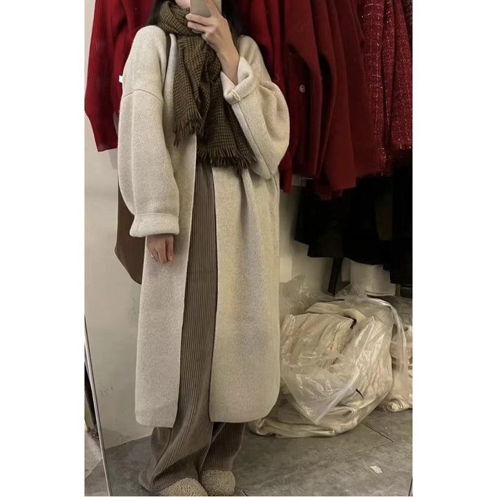 Damer lang strikket kåpe med oversized passform og myk fleecefôr