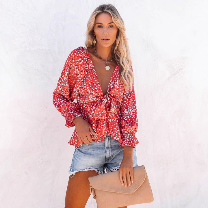 Damer bluse topp med leken blomsterdesign og elegant knute detaljer Skjora