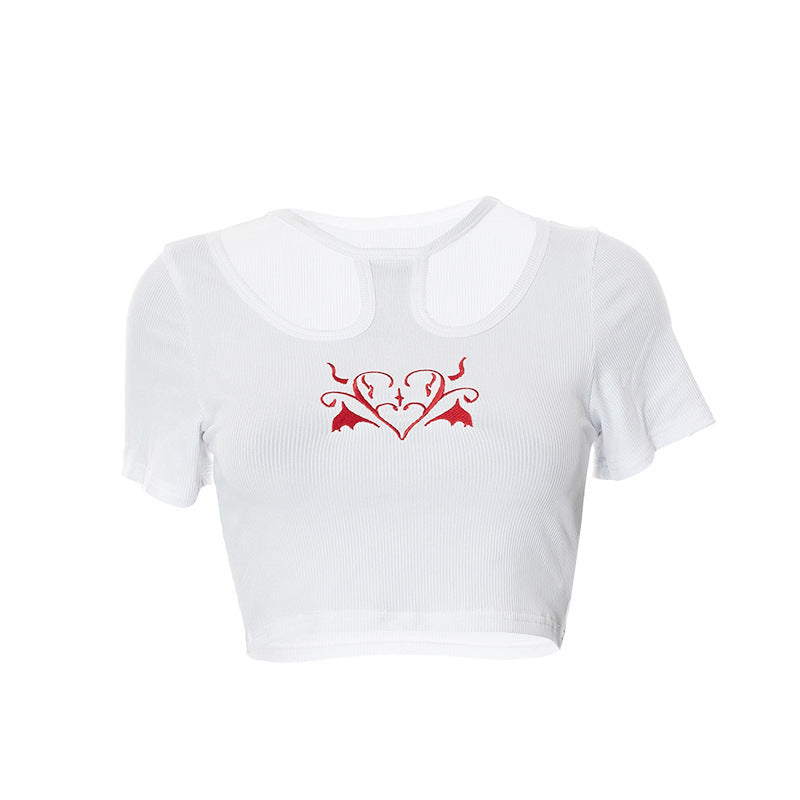 Dame Crop-Top med kreativ cut-out og brodert hjerte-design Skjora