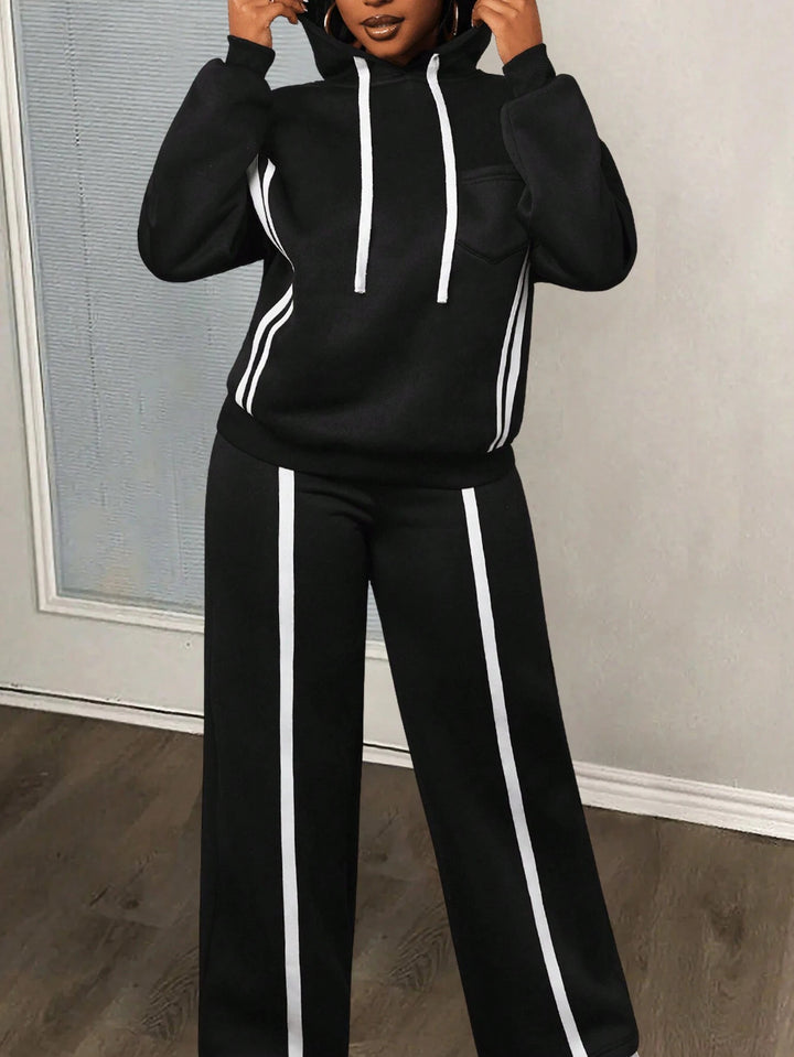 Dame sporty loungewear-set med oppbrettede ermer og sidestreker Skjora