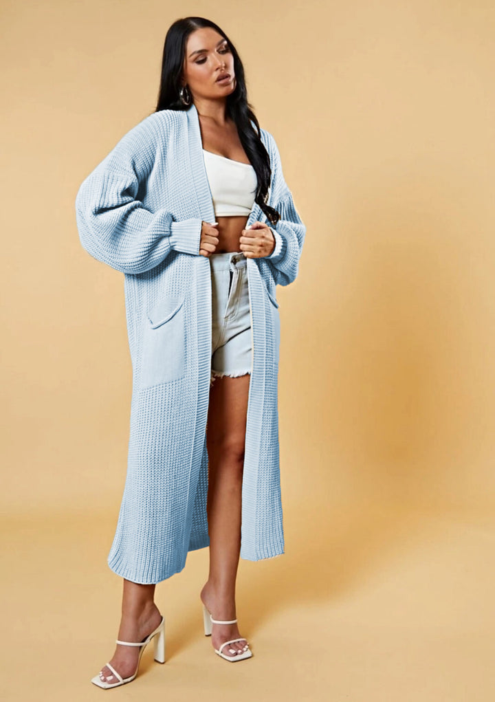 Kvinnes lang strikket cardigan med åpen design og praktiske lommer Skjora