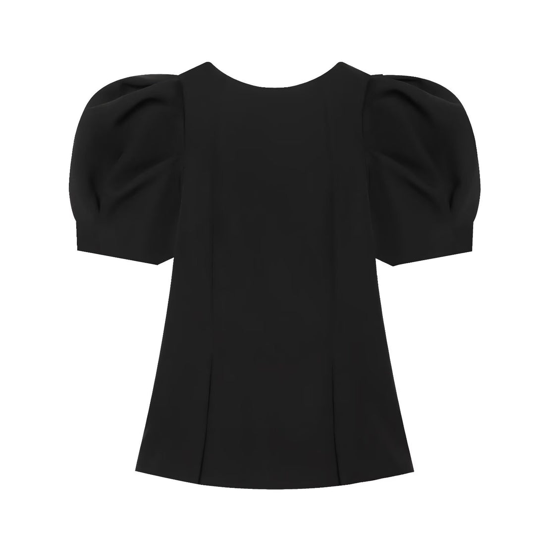 Damebluse med puffarmer og elegant snitt Skjora