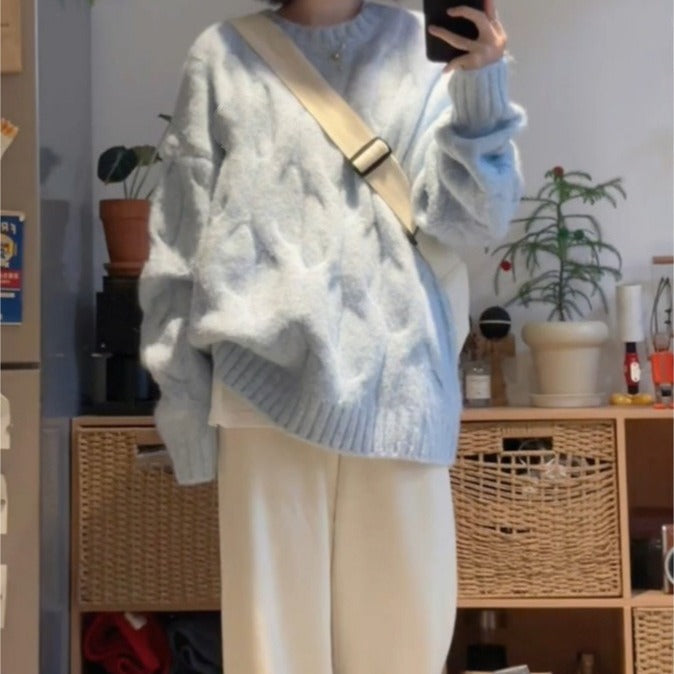 Dame chunky strikkegenser med strukturelt kabelmønster og avslappet passform Skjora