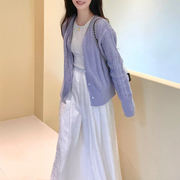 Dame cardigan med delikat mønster og knappdetaljer Skjora