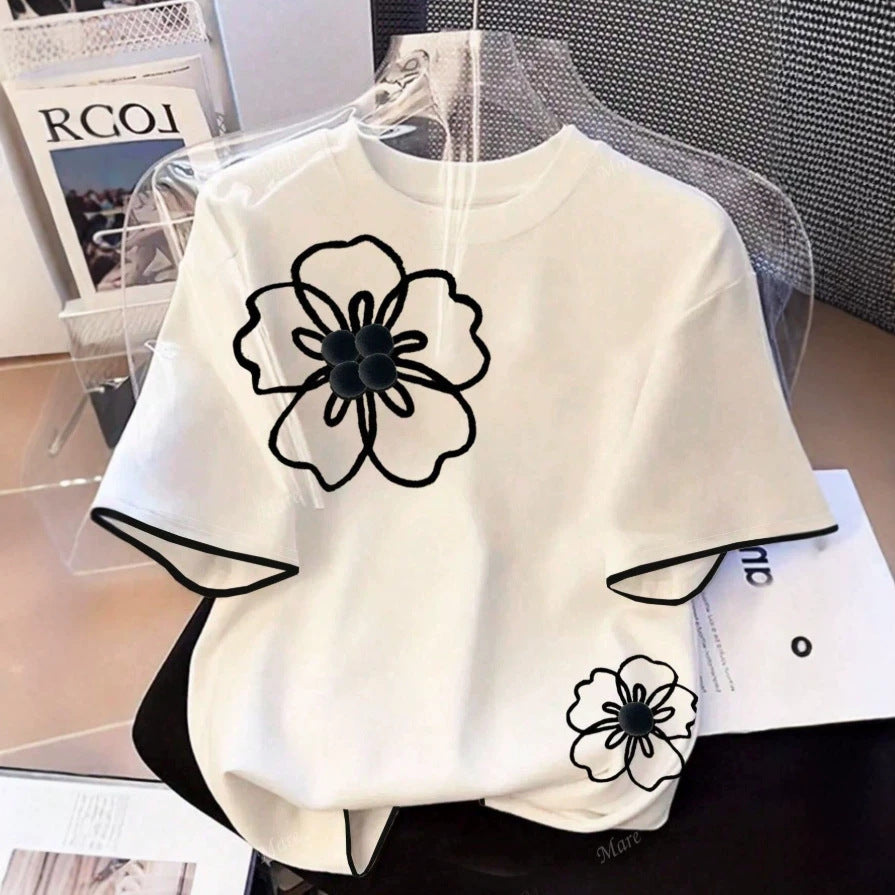 Dame T-skjorte med blomstret design og løs passform Skjora