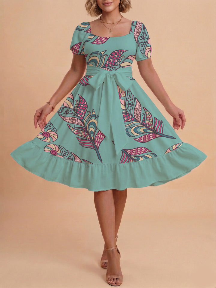 Damen modernes Blumenkleid mit elegantem Taillengürtel und asymmetrischem Saum Skjora