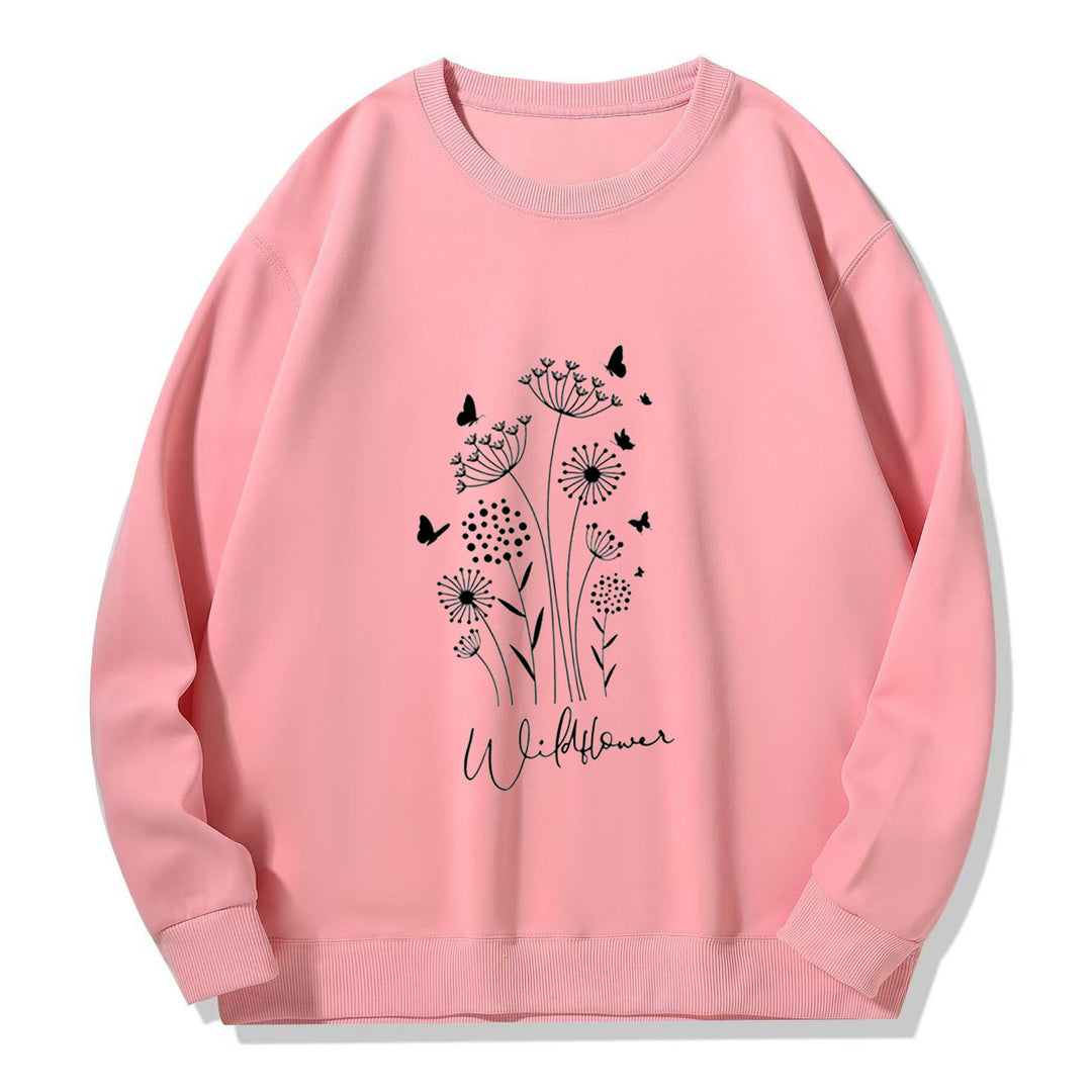 Kvinnelig sweatshirt med blomstertrykk av villblomster og koselig innerfor Skjora