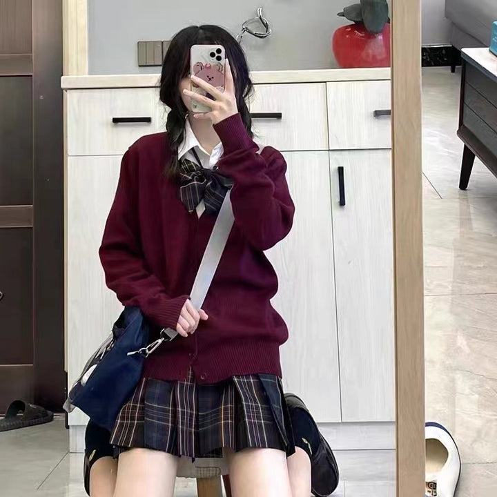 Kvinnes college cardigan med klassisk krage og dekorativ sløjfedesign Skjora