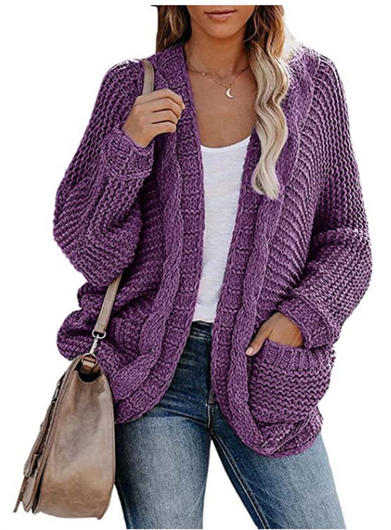 Kvinnes chunky strikk cardigan med uformelle lommer og voluminøse ermer Skjora
