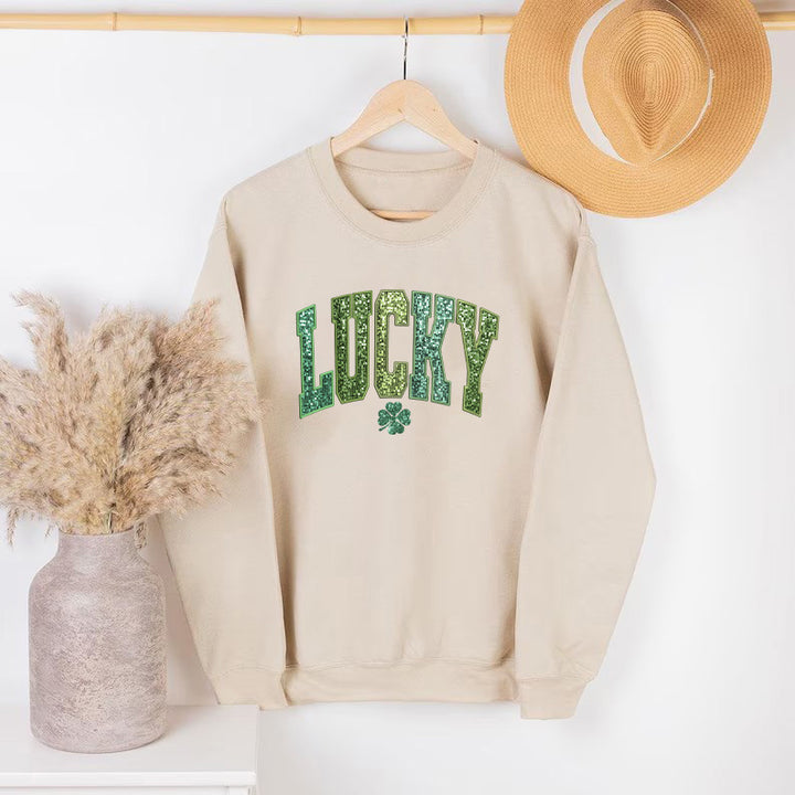Dame uformell sweatshirt med glitrende skrift og firkløvermotiv Skjora