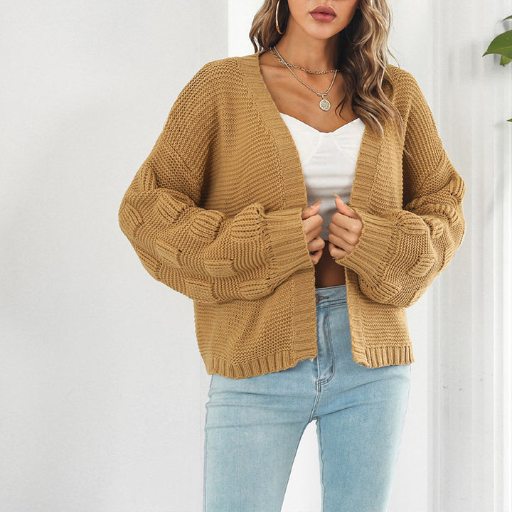 Kvinne chunky strikket cardigan med voluminøse ermer og åpen front Skjora