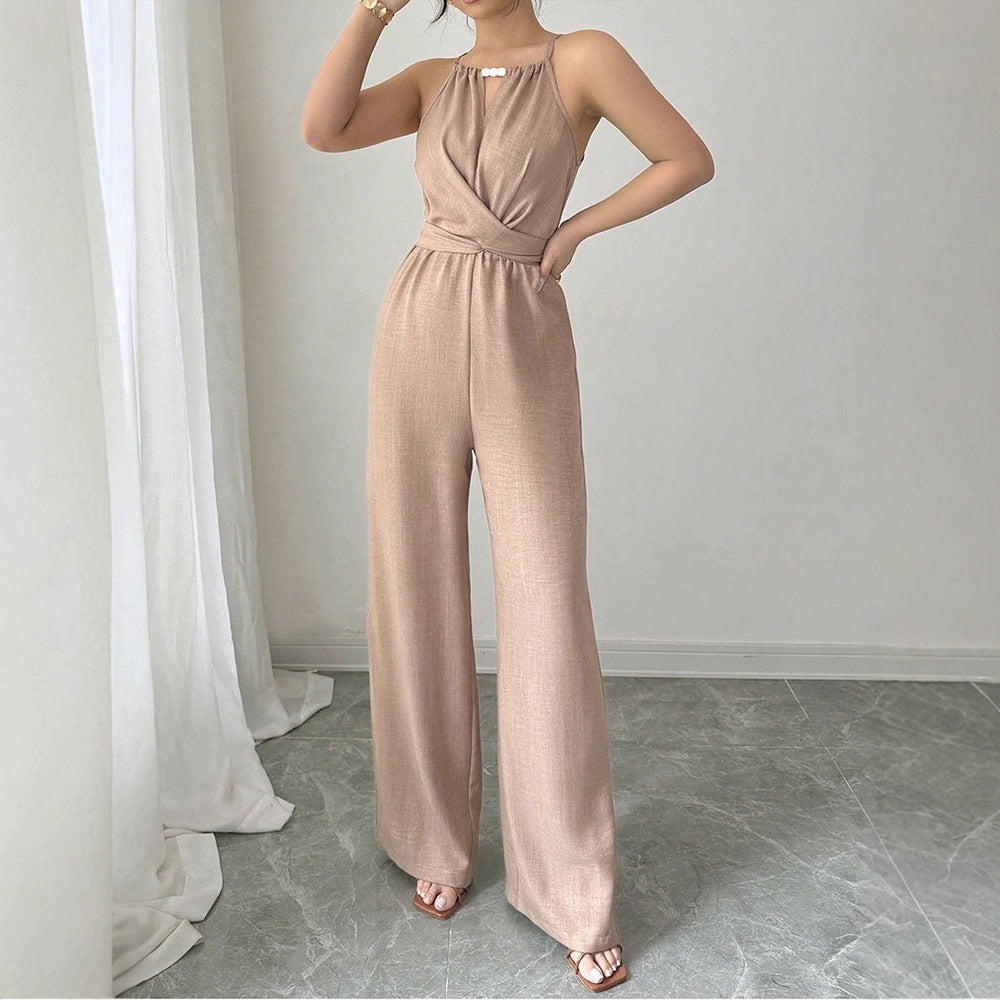 Dame gulvlengde jumpsuit med raffinert omslagdesign og elegant midjebånd Skjora