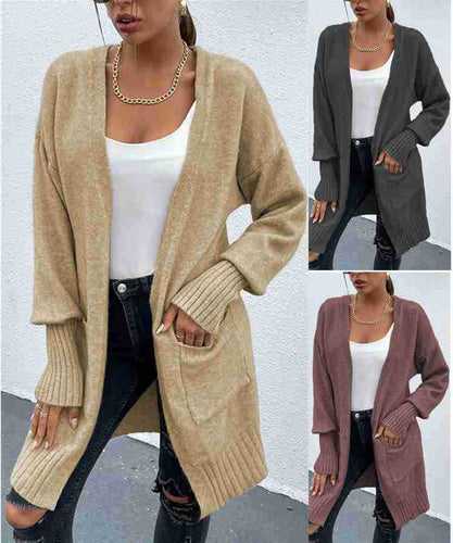 Kvinnens chunky strikk cardigan med dype lommer og avslappet design Skjora