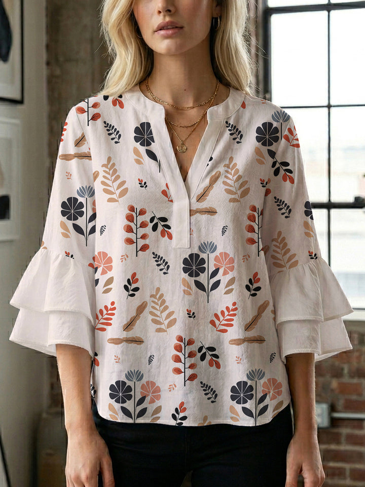 Dame bluse med voluminøse rysjermer og moderne motiv Skjora