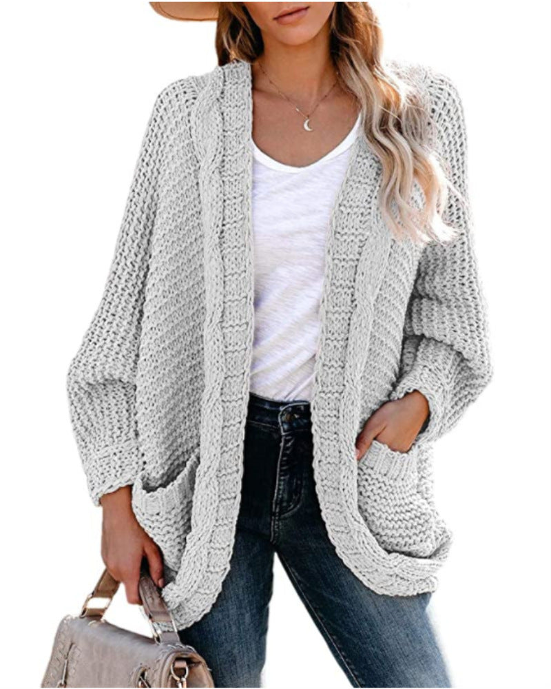 Kvinnes chunky strikk cardigan med uformelle lommer og voluminøse ermer Skjora
