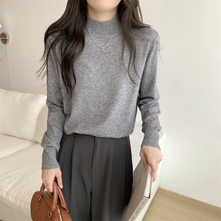 Women's fine-knit sweater with a modern stand-up collar and a relaxed fit Skjora