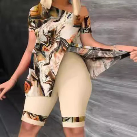 Women's sporty top with stylish asymmetrical cut and figure-flattering shorts Skjora