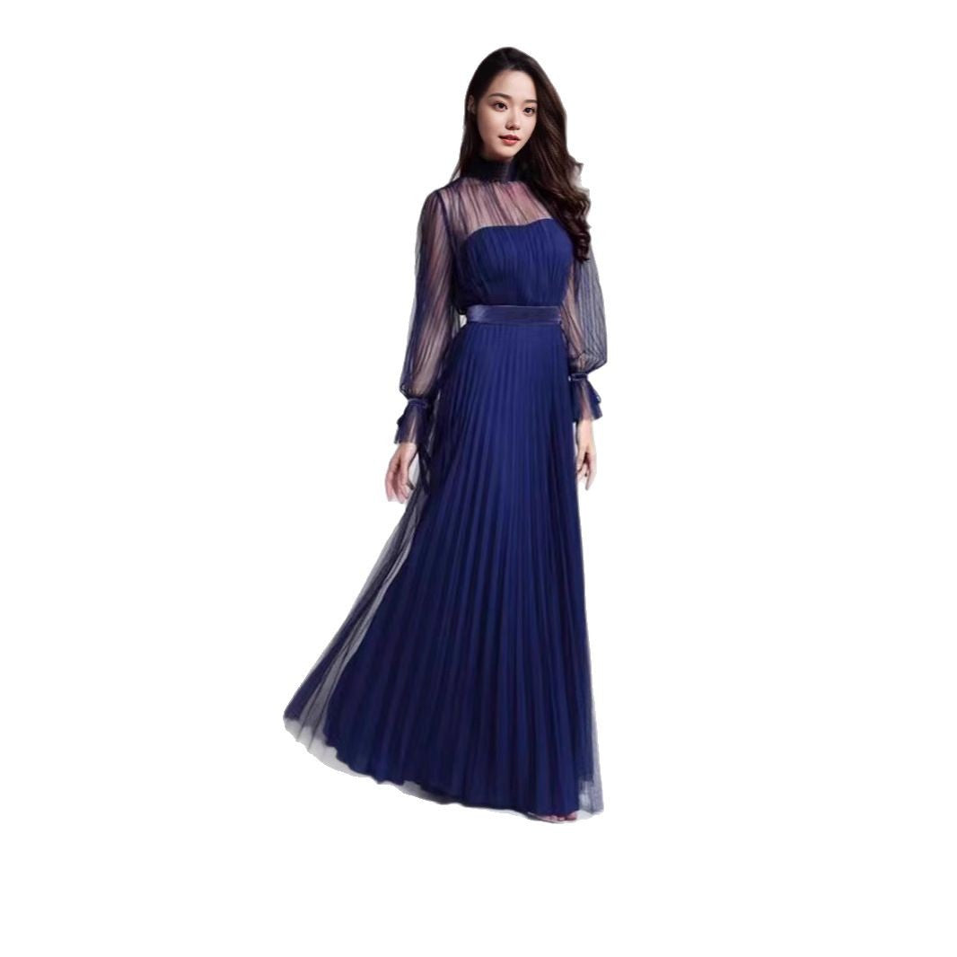 Kvinnens elegante maxikjole med glitrende chiffon og lekne volangdetaljer Skjora