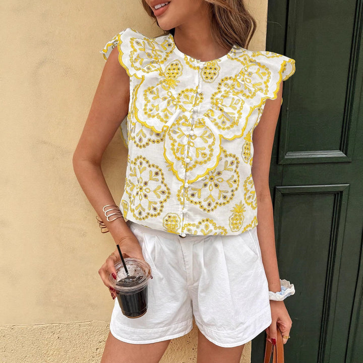 Dame blonde topp med blomstrete broderier og volangdetaljer Skjora