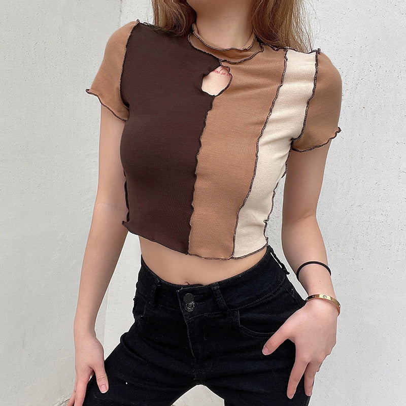 Dame cropped T-skjorte med unikt cut-out-design og kontrastsømmer Skjora