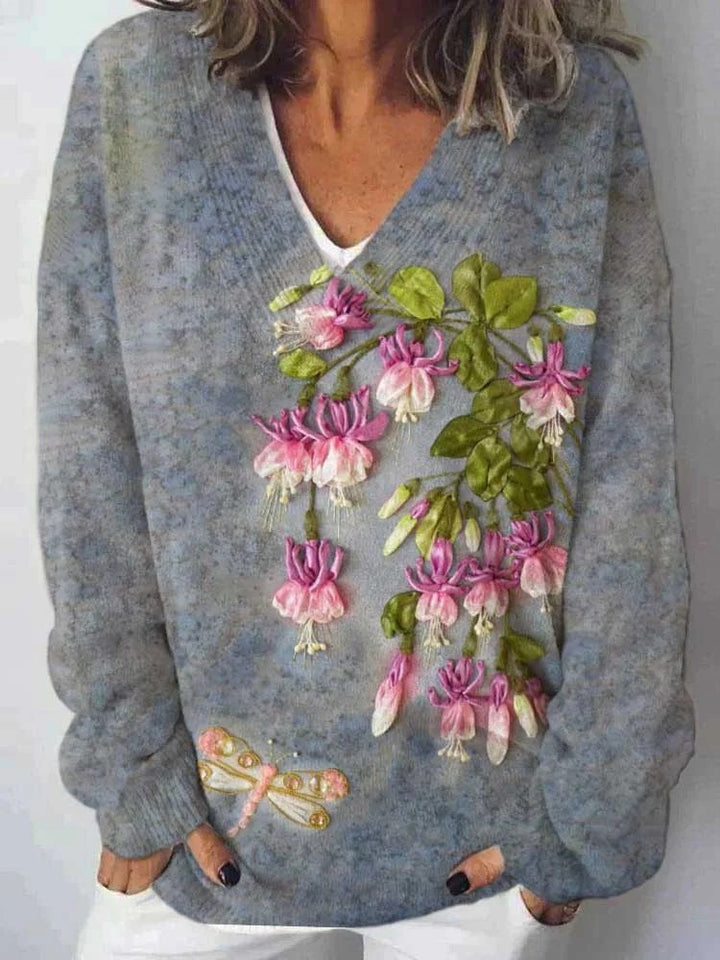 Dame V-hals genser med blomstermønster og avslappet passform Skjora
