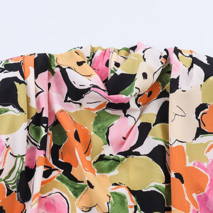 Damebluse med blomsterdesign og elegant knytning Skjora