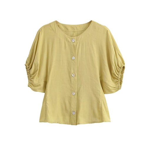 Damebluse med pufferm og dekorative knapper Skjora