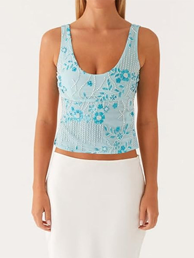 Damescouture topp med blomstret rhinestonesdesign og tettsittende snitt