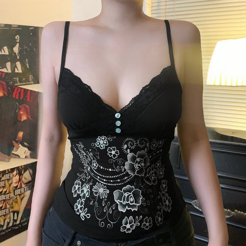Damen spissetopp med floral design og dekorative knapper Skjora