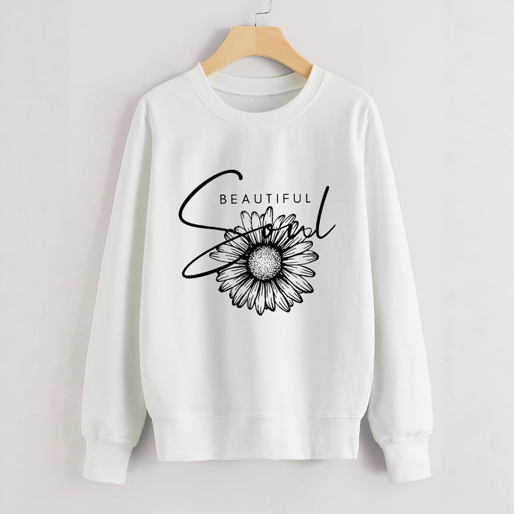 Dame genser med blomstermotiv og inspirerende tekst Skjora