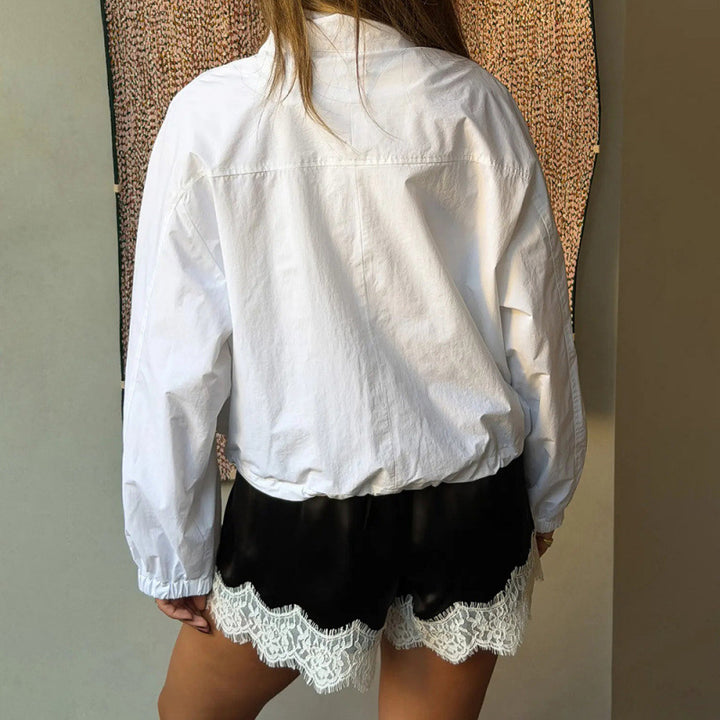 Dame Sportbodysuit med elastiske shorts og blonderdetalj Skjora
