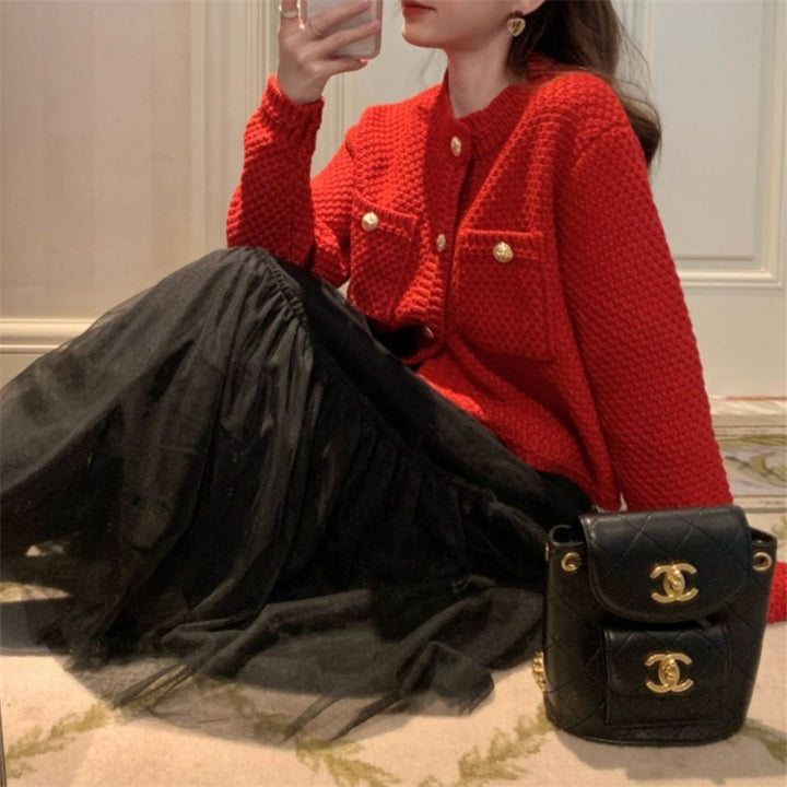 Dame cardigan med dekorative knapper og teksturert design Skjora