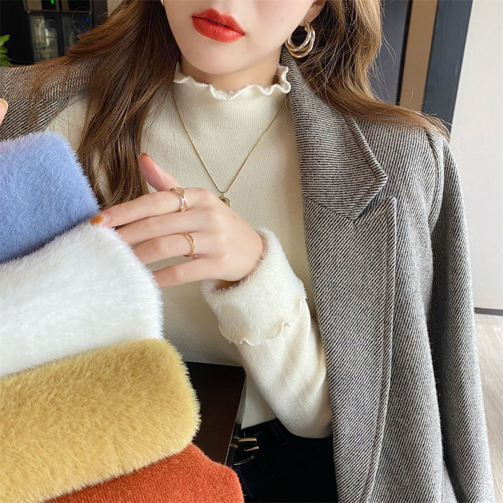 Kvinne Kort Turtleneck Genser med Ulike Materialblandinger Skjora