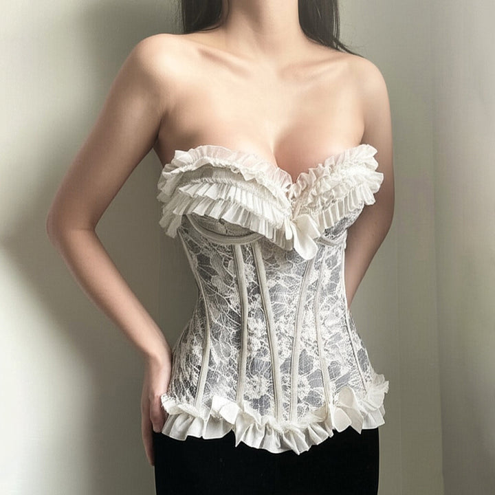 Dame spiss-bustier med volangdetaljer og sløyfer Skjora