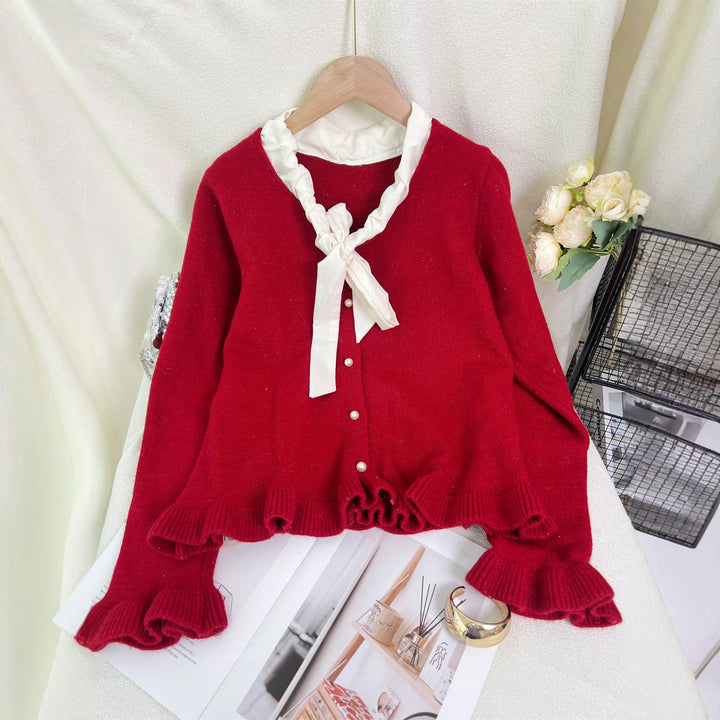 Kvinnes elegant cardigan med volanger og sløyfekrage Skjora