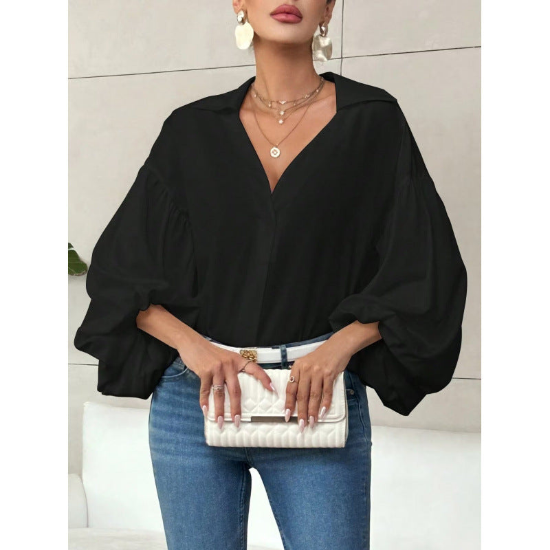 Damebluse med voluminøse ballongermer og elegant krage Skjora