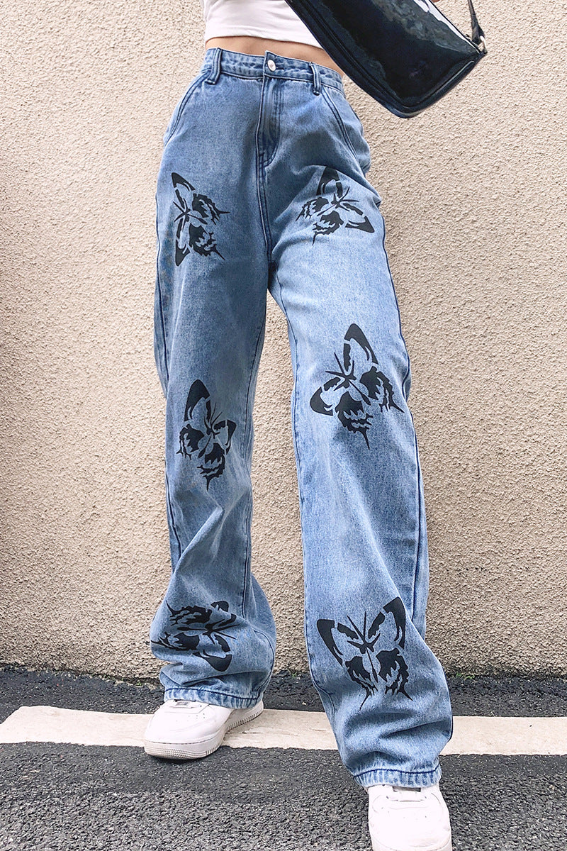 Dame vide jeans med iøynefallende sommerfugltrykk Skjora