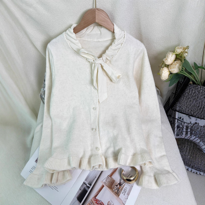 Kvinnes elegant cardigan med volanger og sløyfekrage Skjora